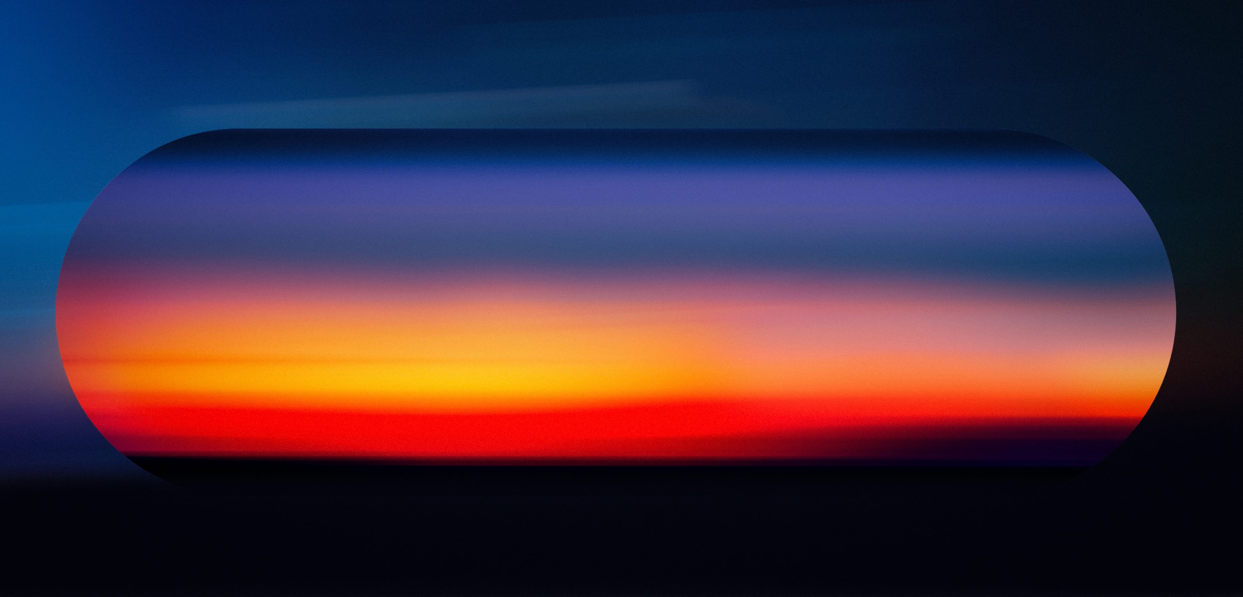 A dark lozenge containing a concentrated orange-red horizon