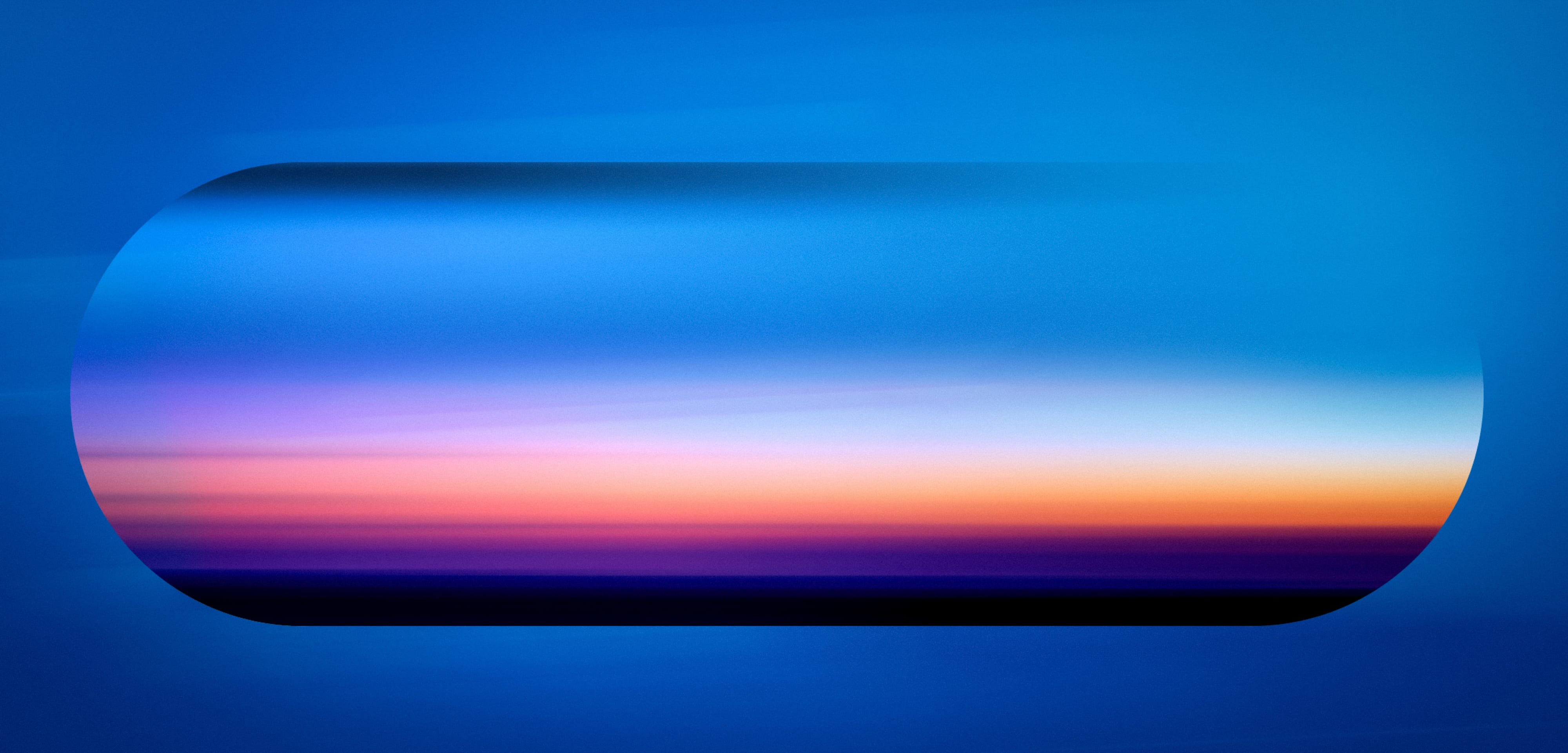 A blue atmospheric lozenge holding a soft pink horizon