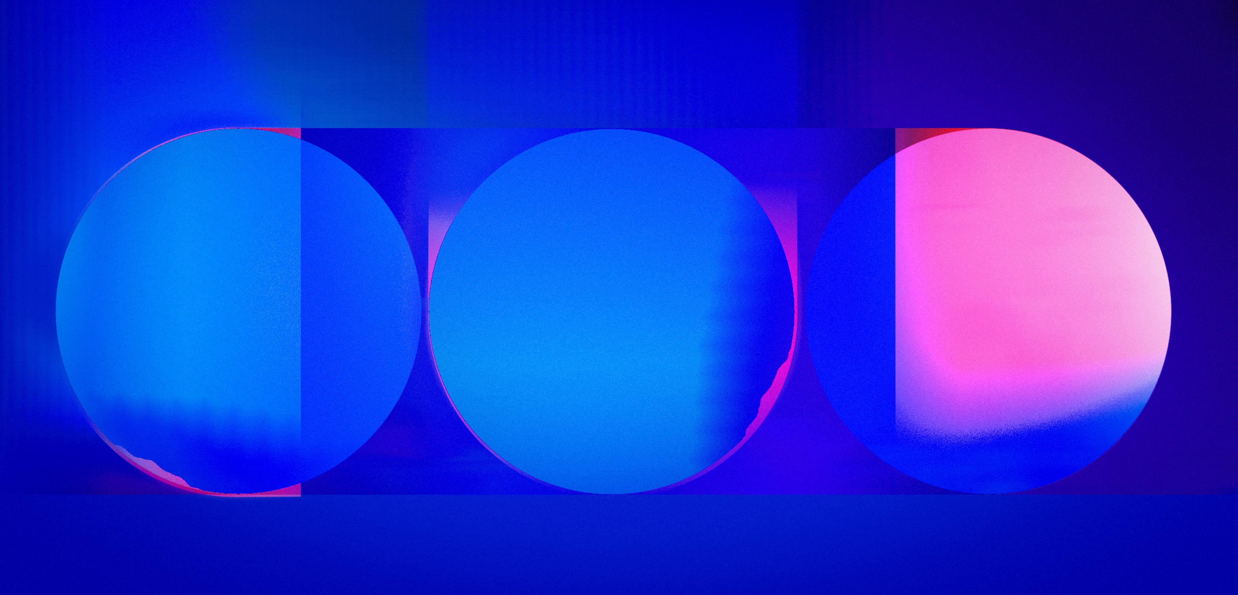 Layered blue and pink circular structures held within the lozenge display format