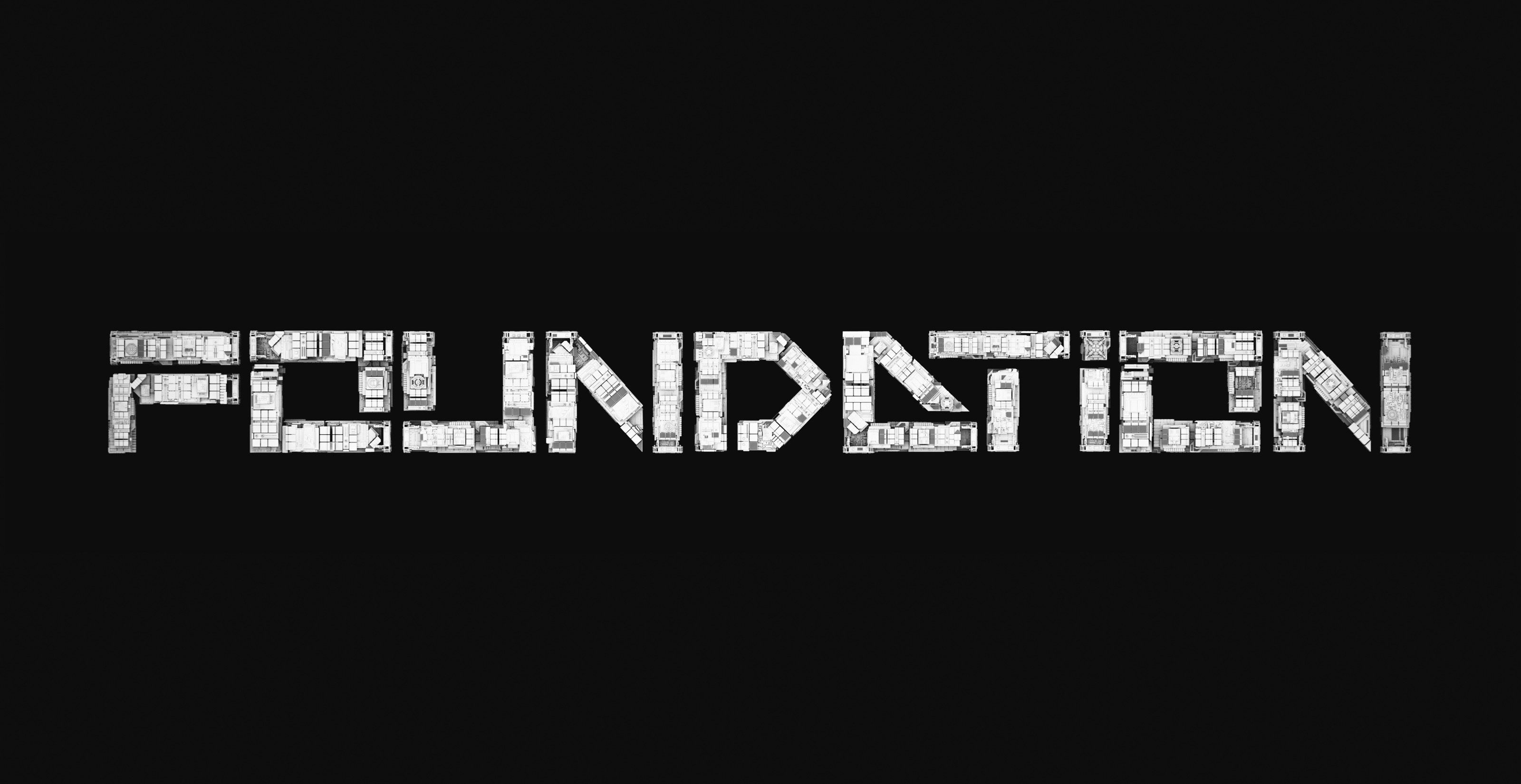 White three-dimensional FOUNDATION wordmark suspended against black