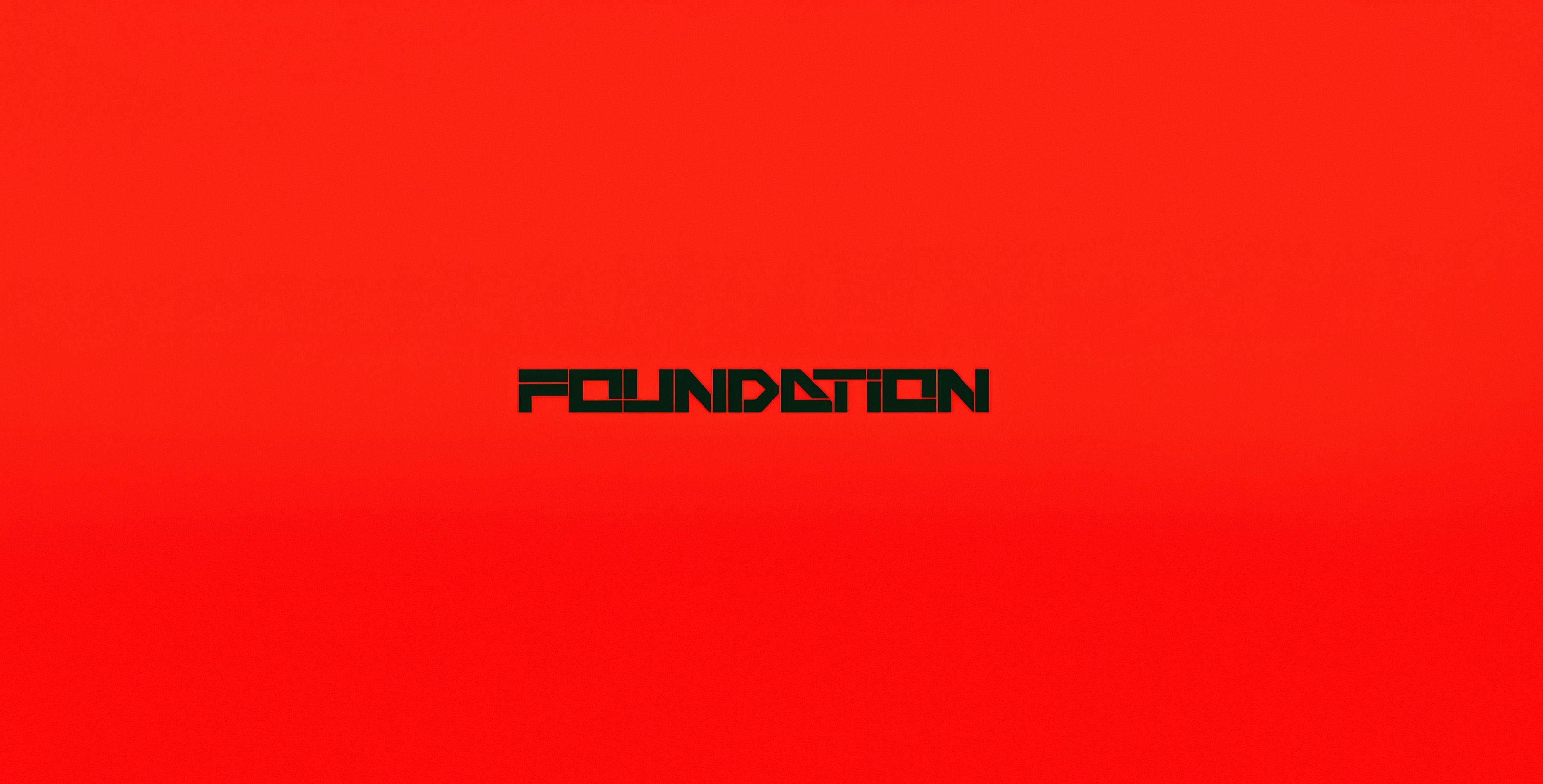 Reduced FOUNDATION title mark held within a vivid red field