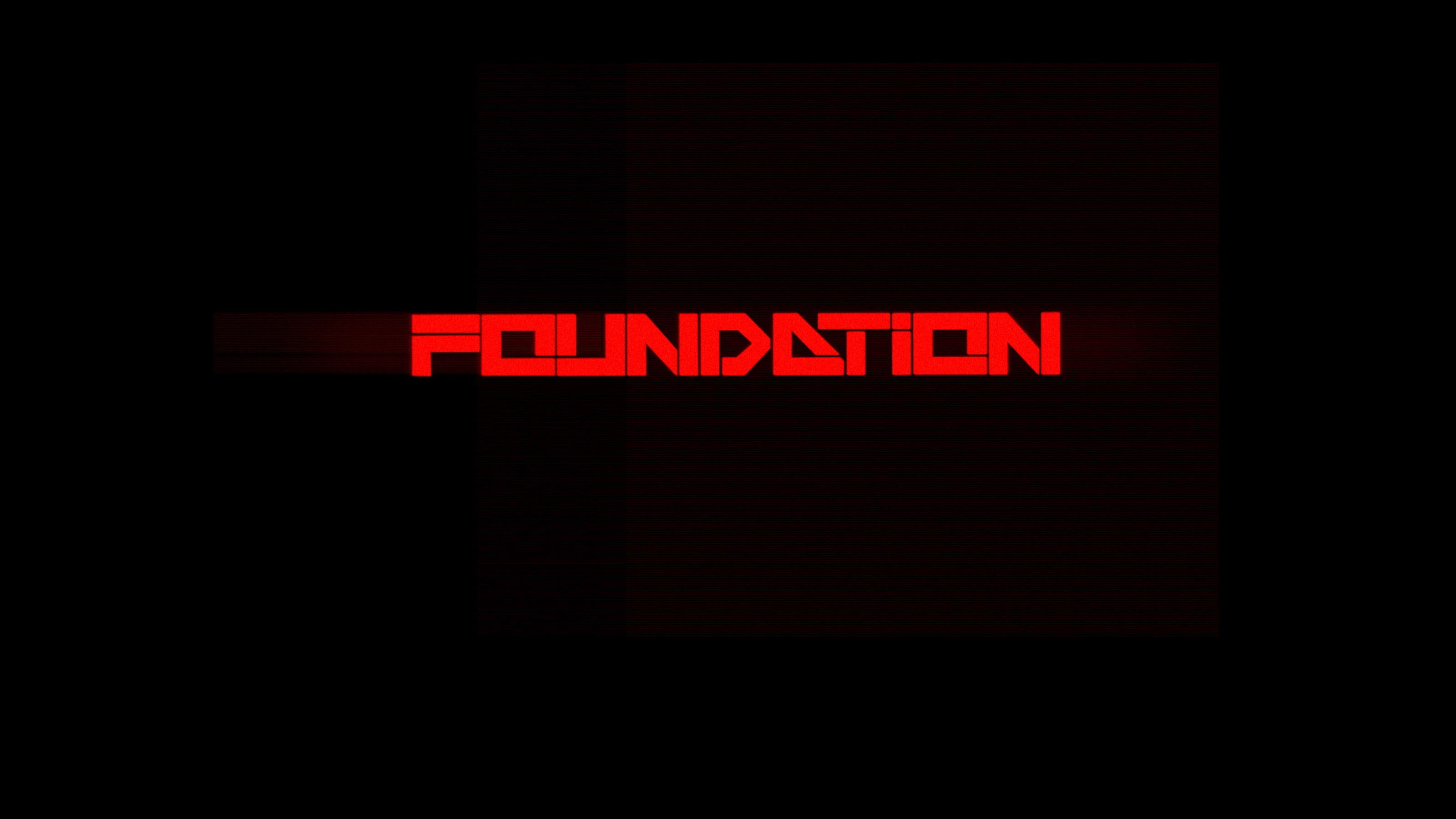 Red and black transitional FOUNDATION title composition with scan-line texture