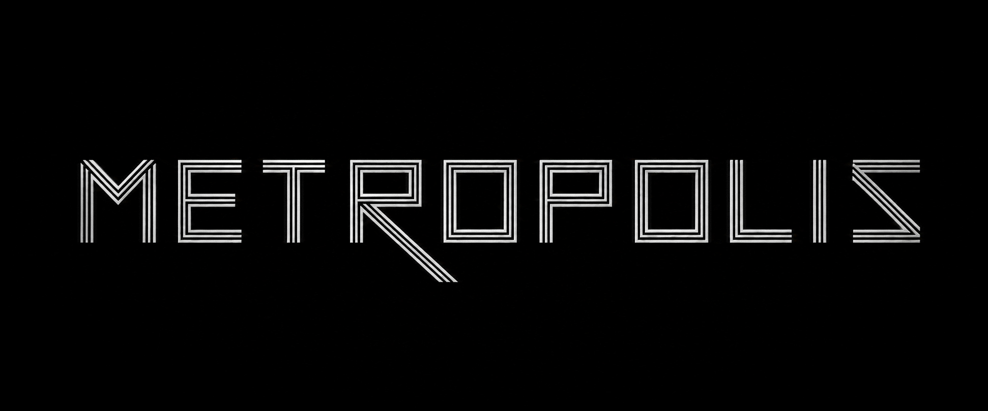Evenly spaced METROPOLIS letterforms drawn in parallel white strokes on black