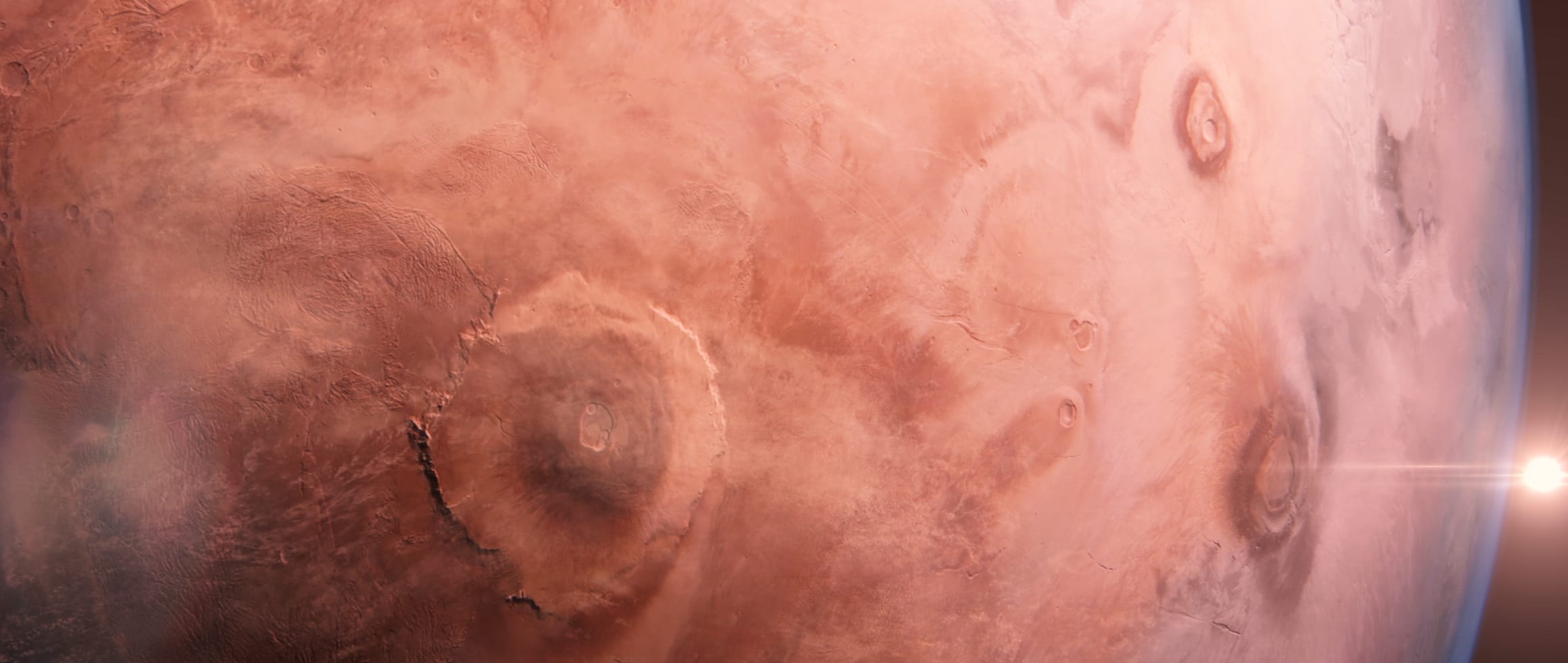 Close view of Mars with sunlight breaking around the planetary edge