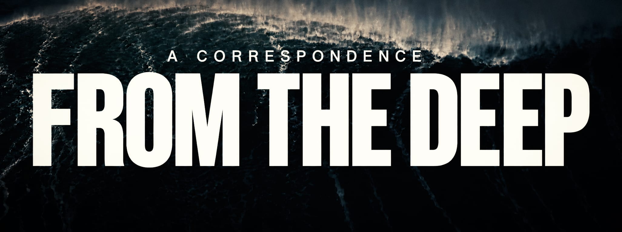 From the Deep set at maximum scale across a dark aerial ocean wave