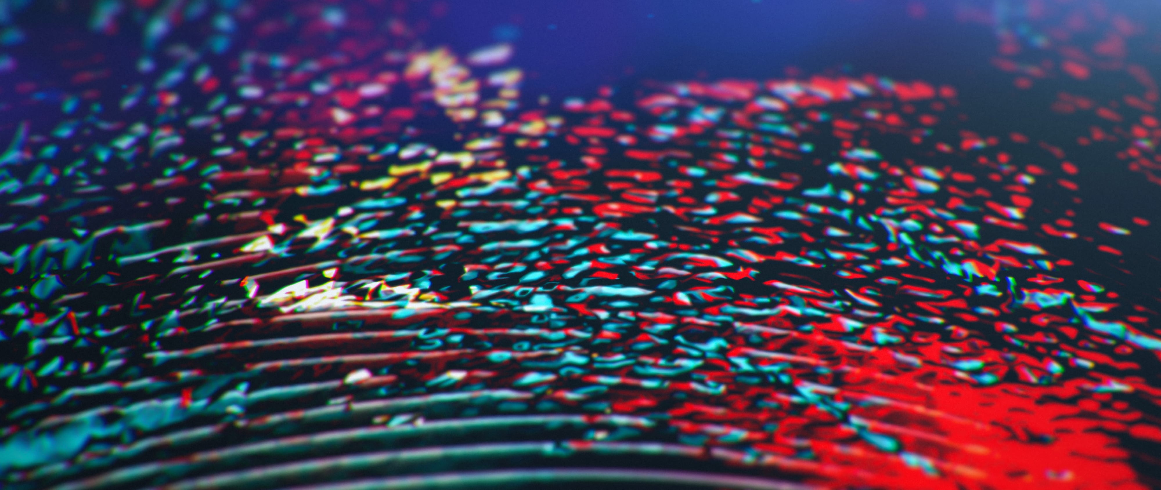 A close chromatic material study formed from red, cyan and blue granular reflections